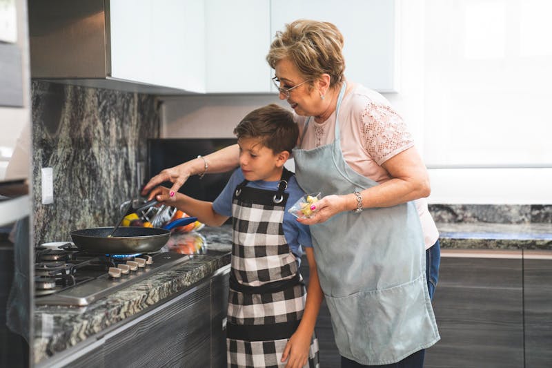 Parents and children preparing healthy meal together